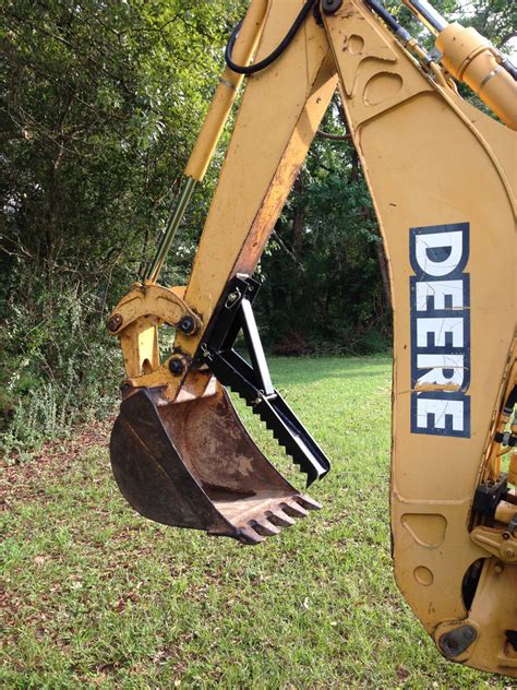 thumb attachment for small backhoe